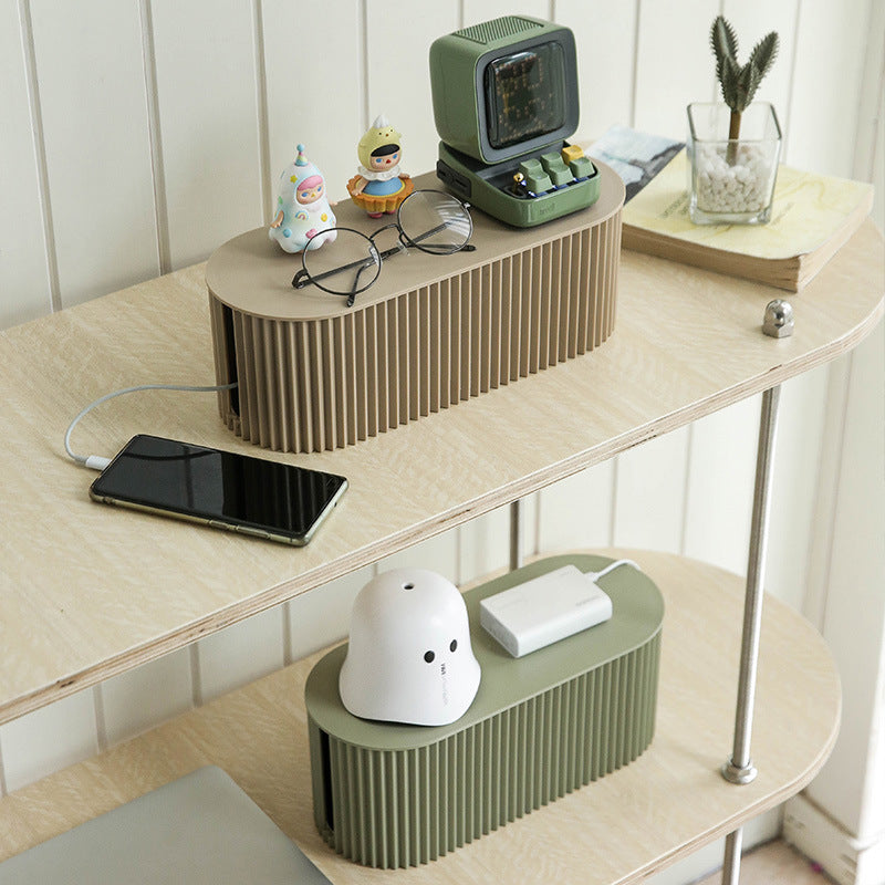 Ribbed cable organizer box with oval shape