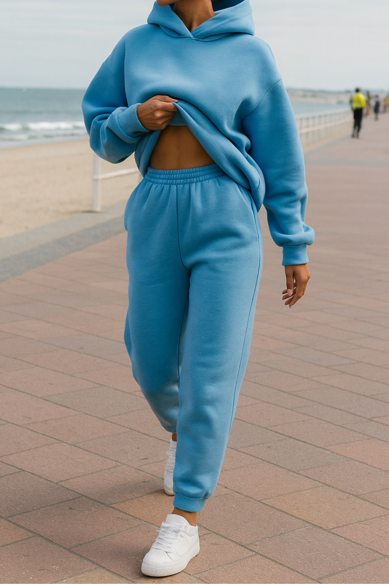 Women’s blue matching tracksuit set with oversized hooded sweatshirt and elastic waist jogger pants