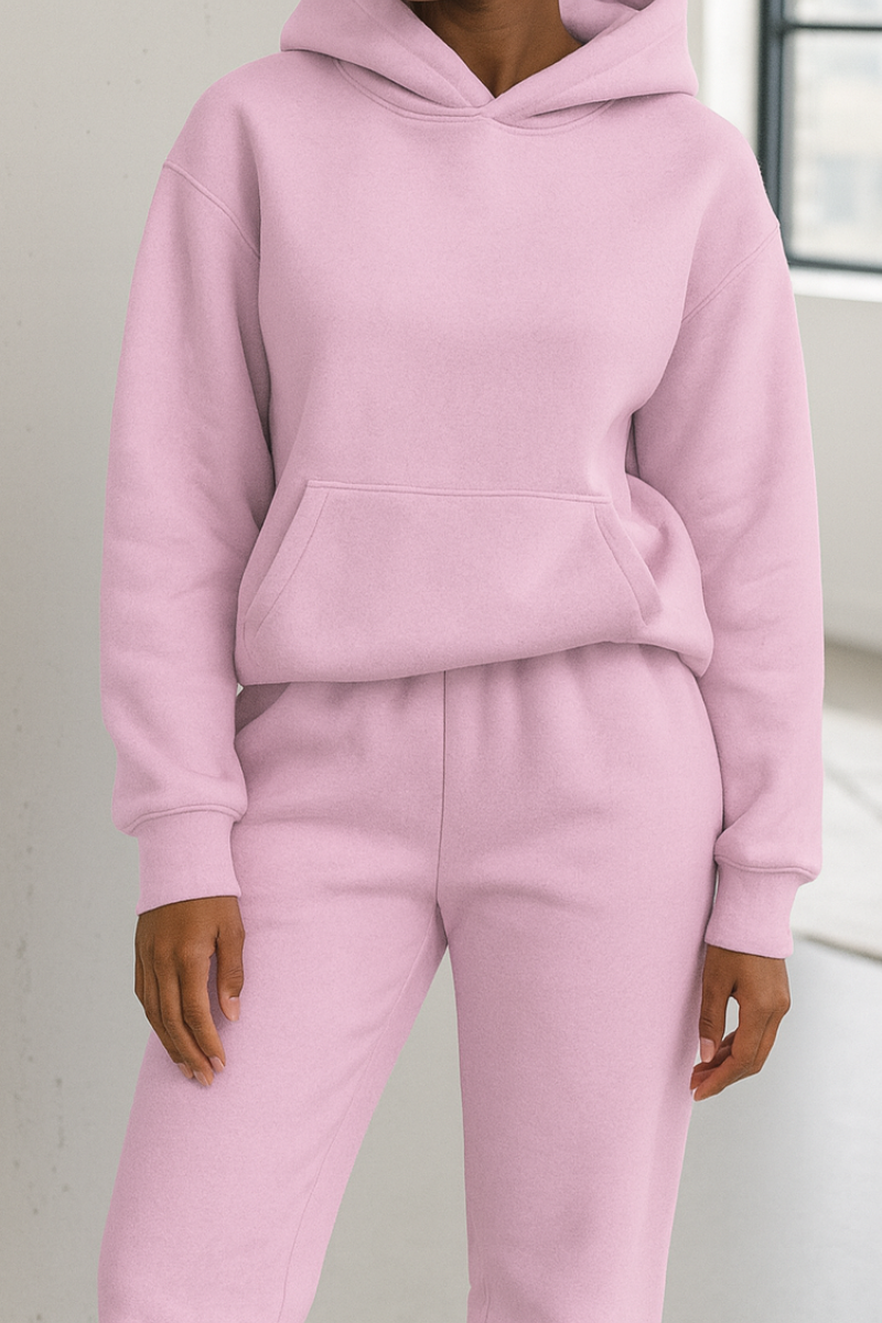 Women’s light pink hoodie and joggers matching set with kangaroo pocket and elastic waist sweatpants