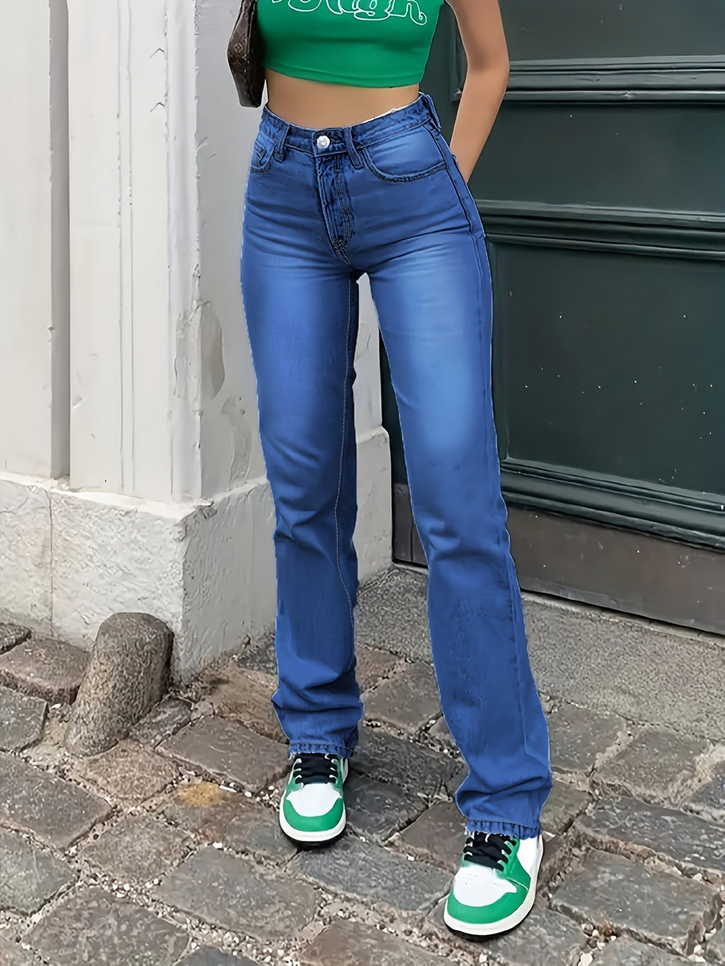 High-waist straight-leg jeans in medium blue wash with clean finish.