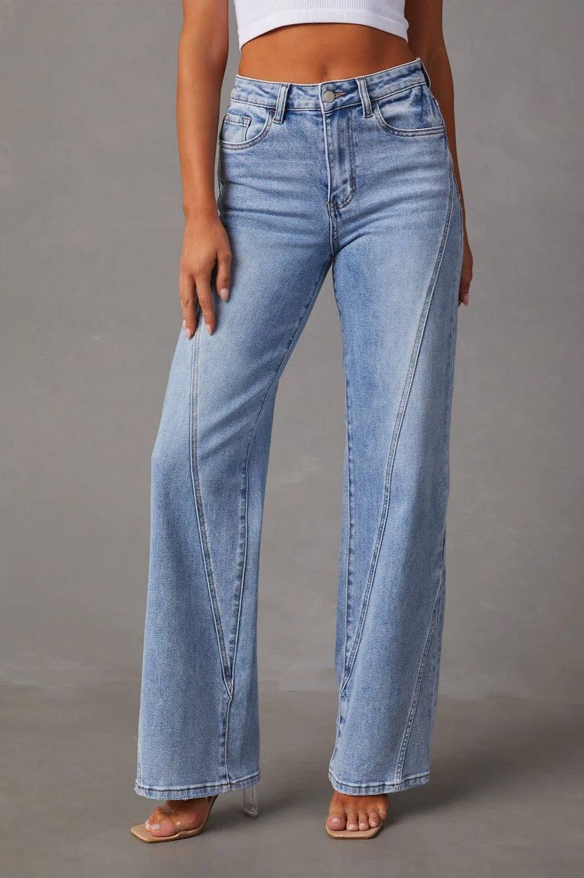 Denim wide-leg jeans with high waist and front pockets, casual fit, women, studio view