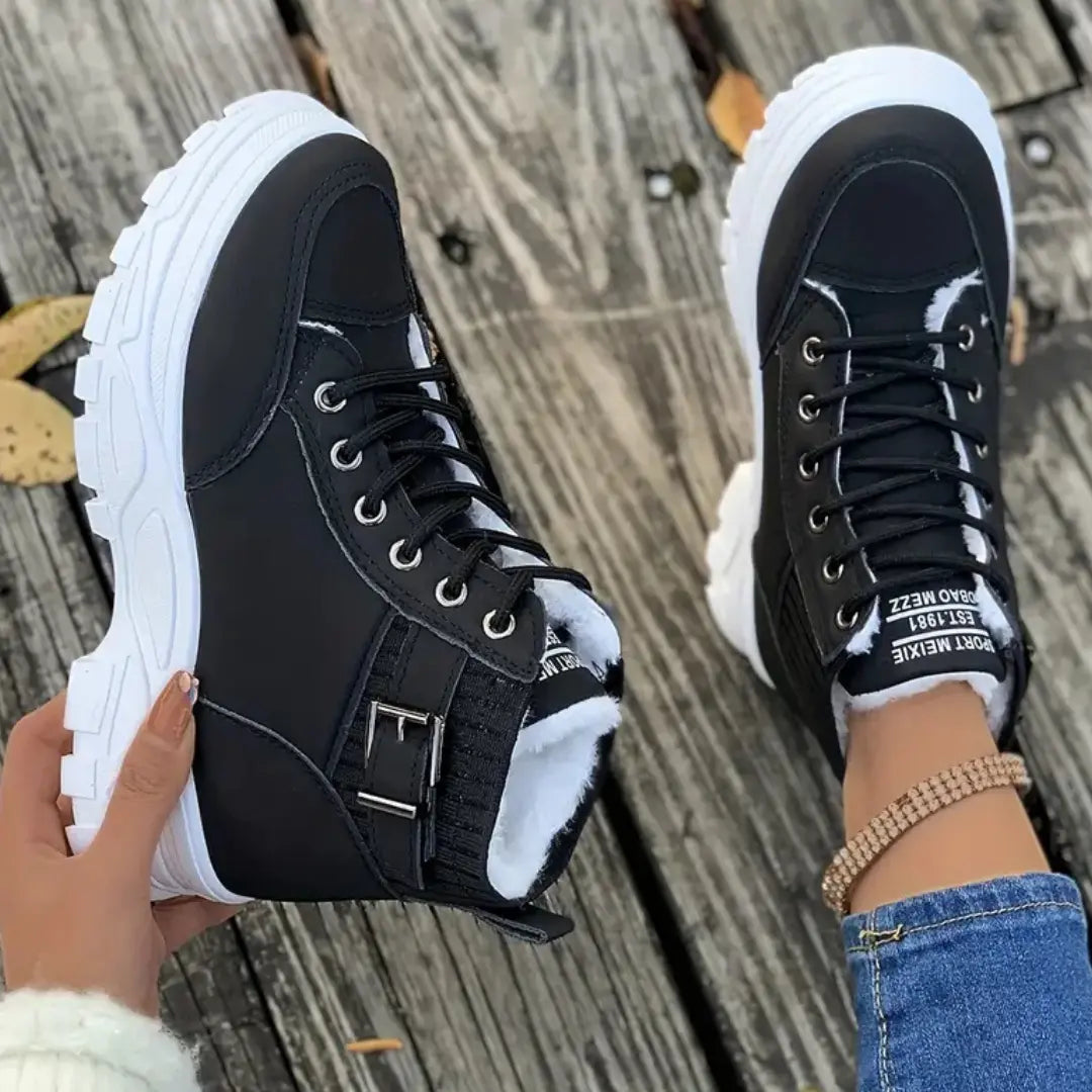 Synthetic leather ankle boots with lace-up closure and buckle strap, padded collar, women