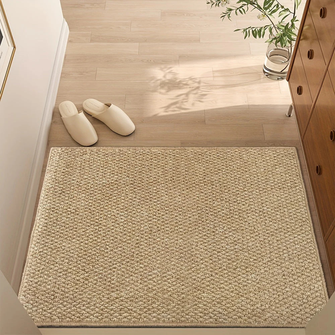Woven fiber rectangular floor mat with dense textured surface and reinforced edges for indoor entry