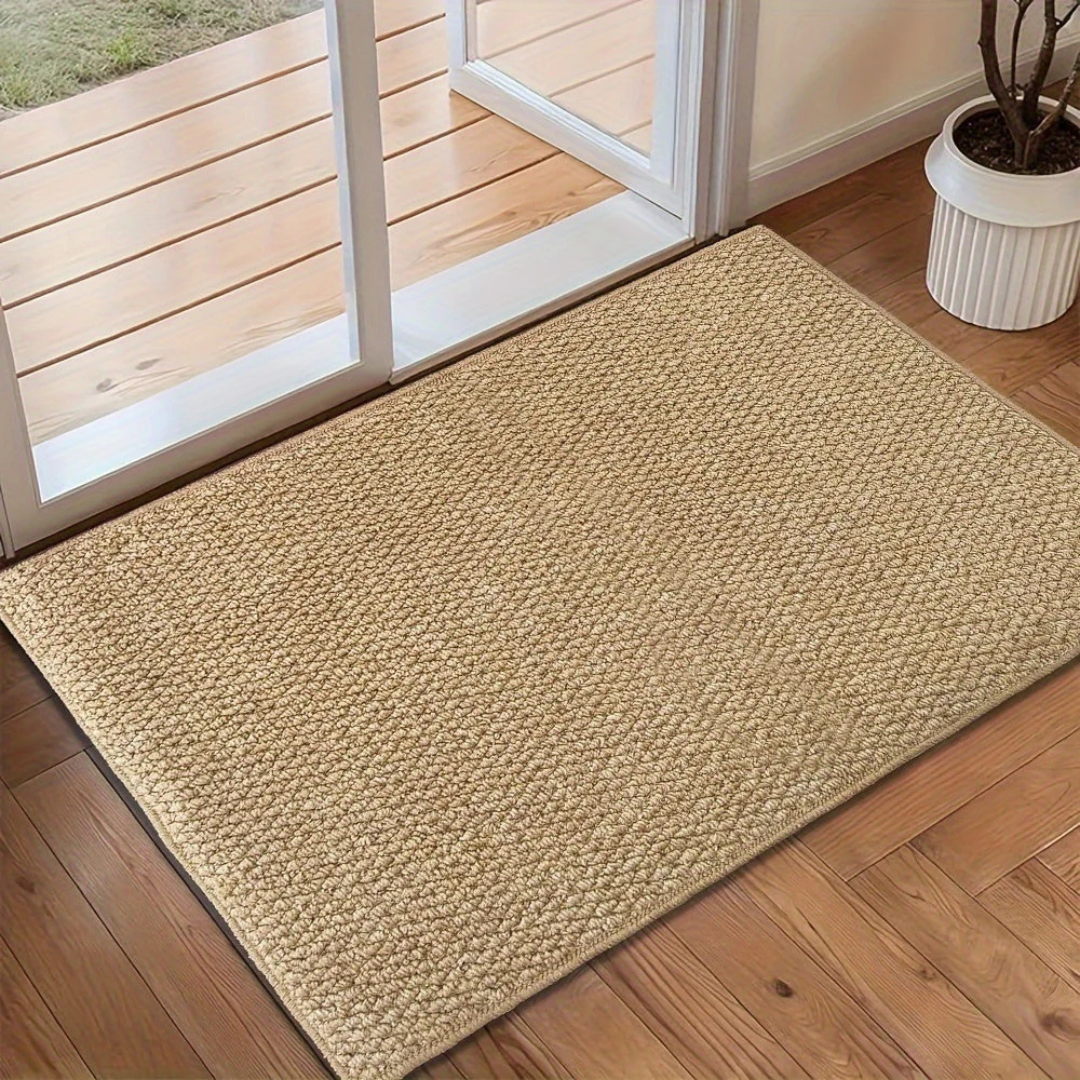 Tightly woven rectangular door mat with uniform surface pattern and non-slip construction