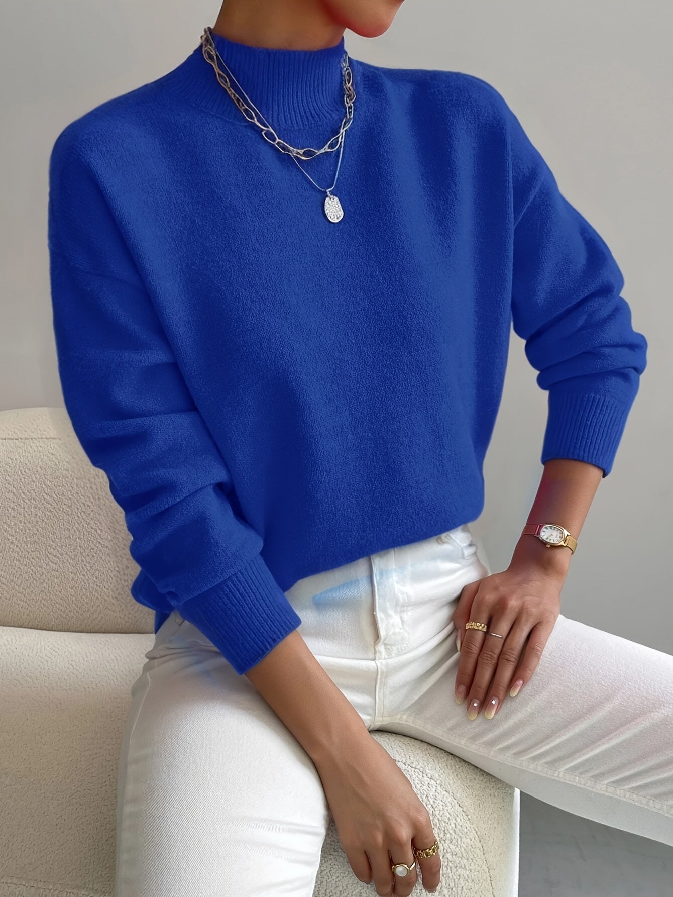 Knit jumper with soft knit texture and fitted cuffs, regular fit, women, seated indoors