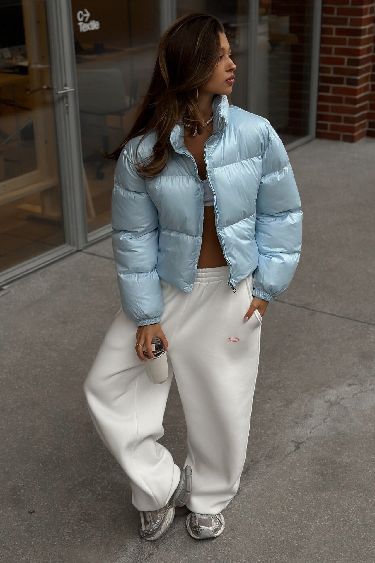 Padded puffer jacket with long sleeves and smooth outer surface, loose fit, women, worn outdoors