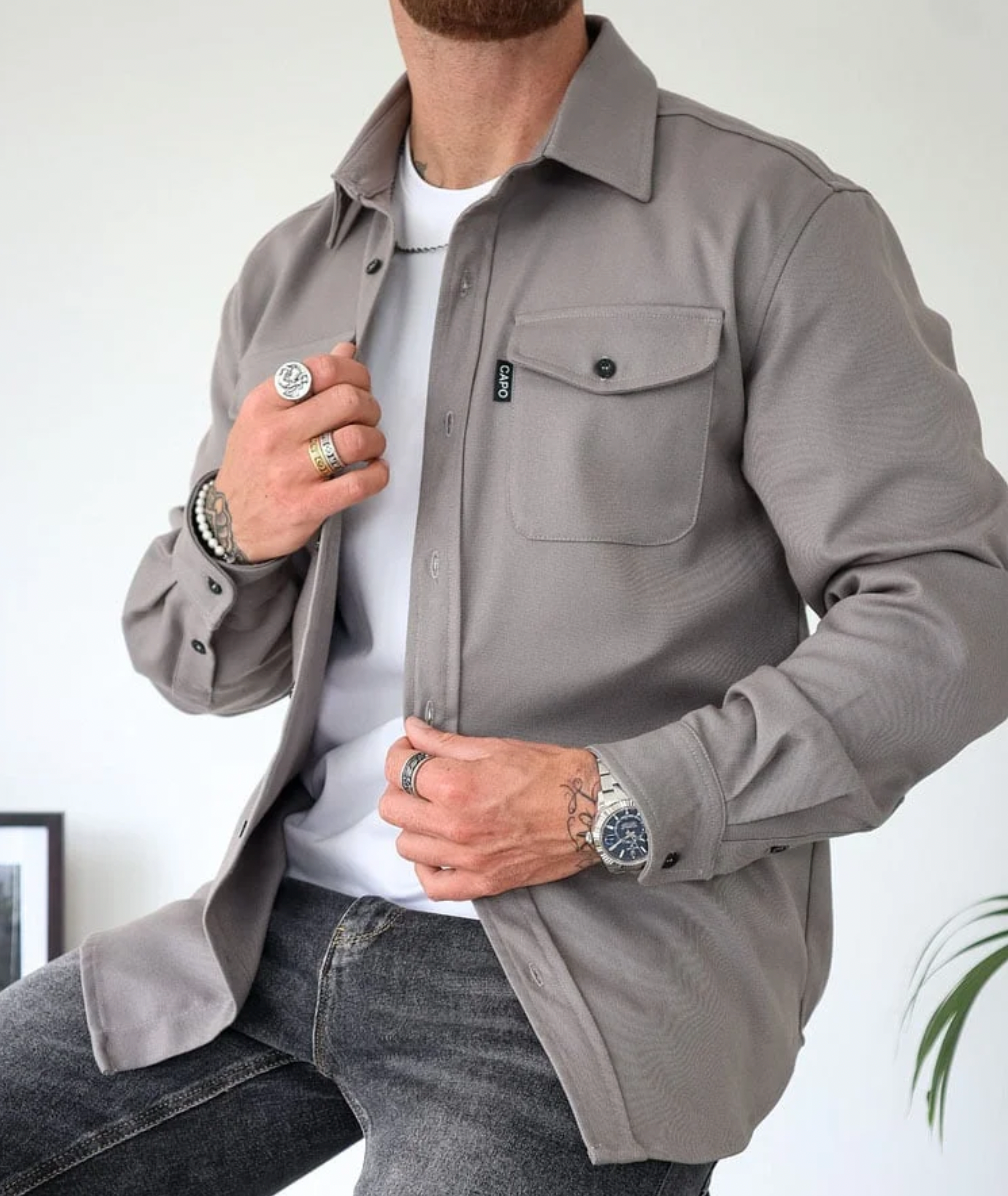 Woven overshirt with panel construction and straight hem worn as a layering piece