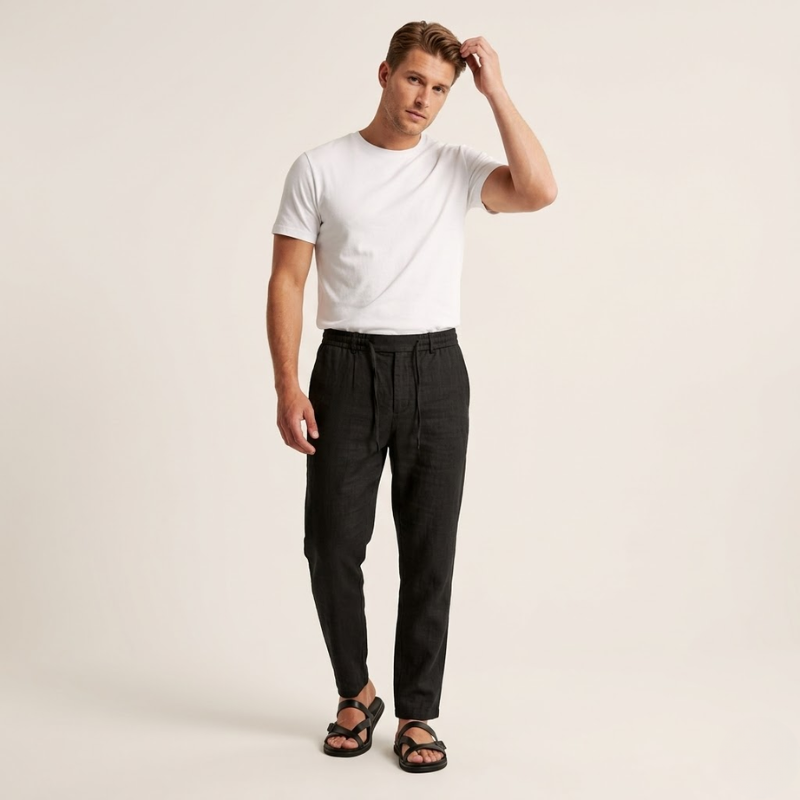 Woven fabric trousers with elastic drawstring waist and tapered leg for men