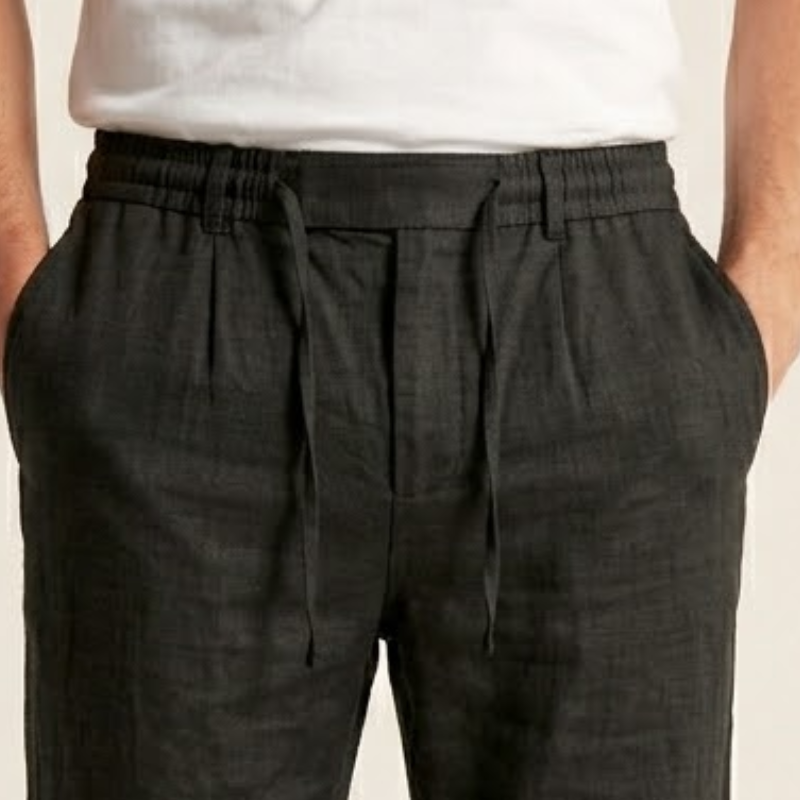 Woven fabric men's trousers with elastic waistband and tapered silhouette
