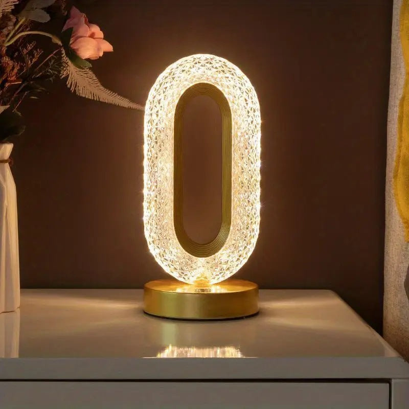 Decorative oval LED bedside lamp with glittering crystal design and gold base