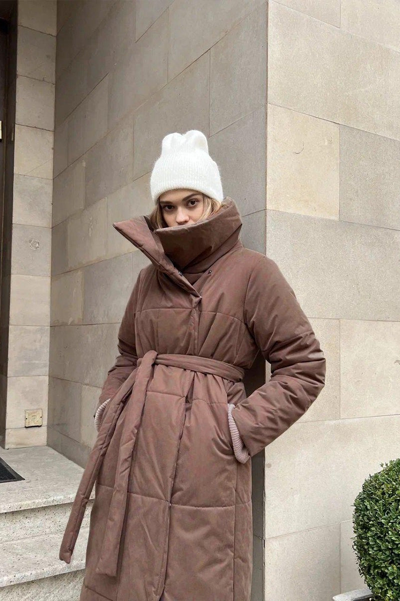 Padded long coat with extended length and loose silhouette, oversized fit, women, urban setting