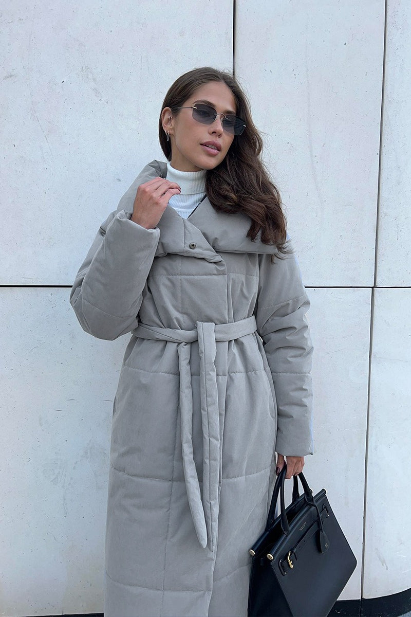 Padded long coat with relaxed fit and structured outer shell, oversized fit, women, city scene