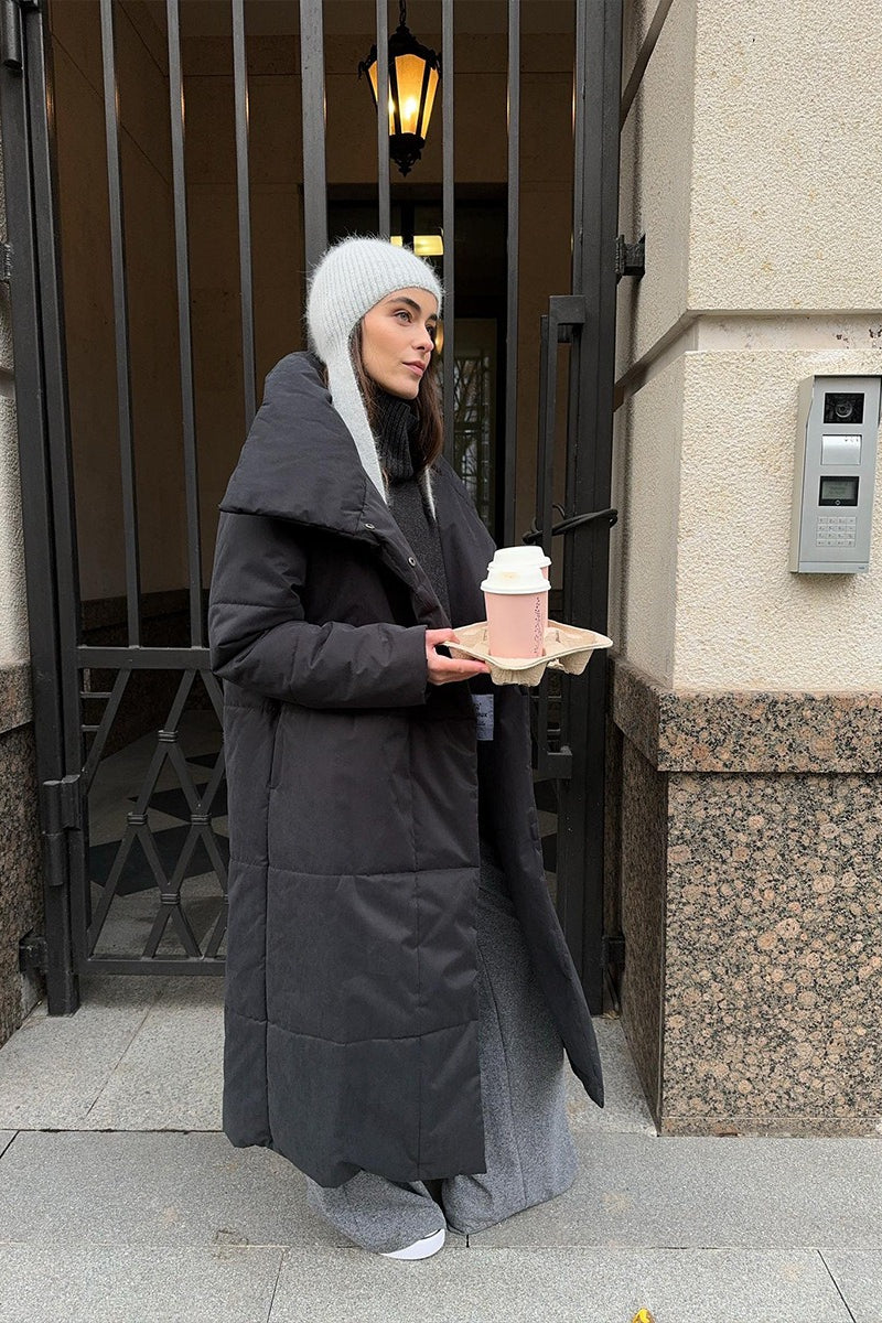 Padded long coat with oversized shape and long sleeves, oversized fit, women, worn outdoors