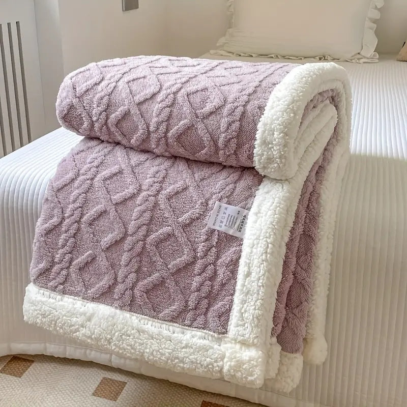 Lavender plush sherpa blanket with textured pattern and white sherpa border.