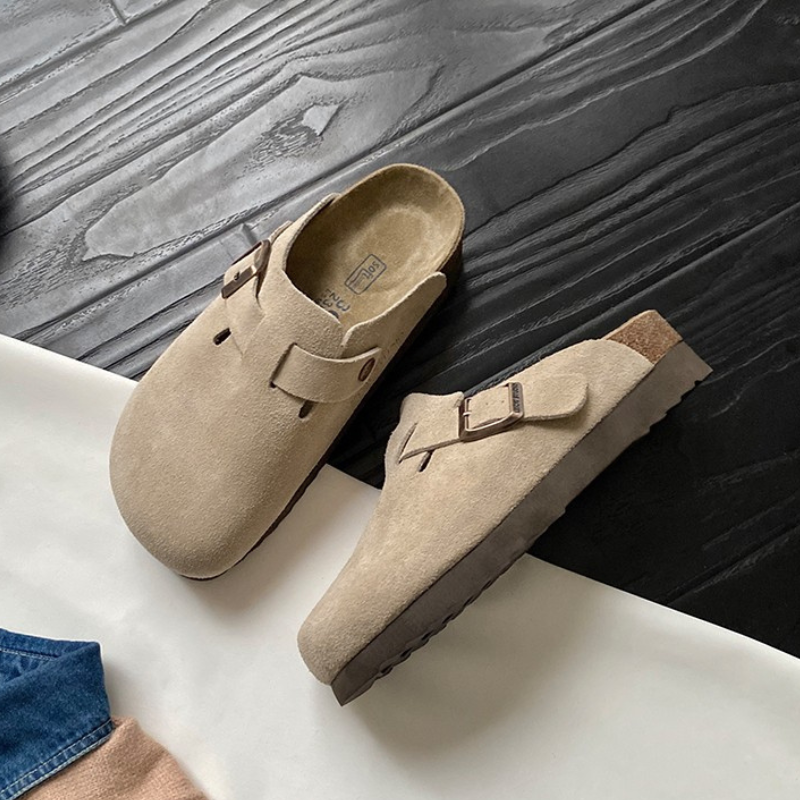 Structured clog silhouette with stitched upper and matte textured surface finish