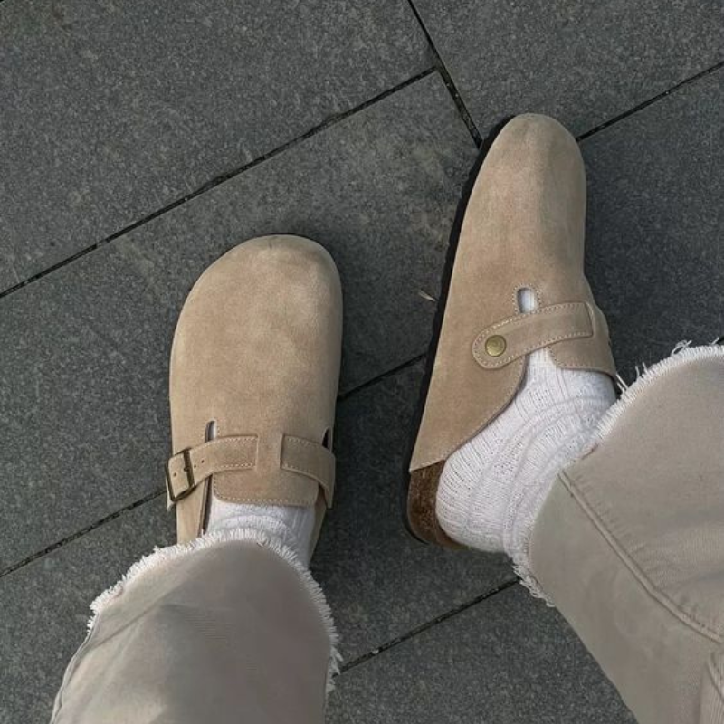 Slip-on clog with buckle strap closure and low-profile molded footbed