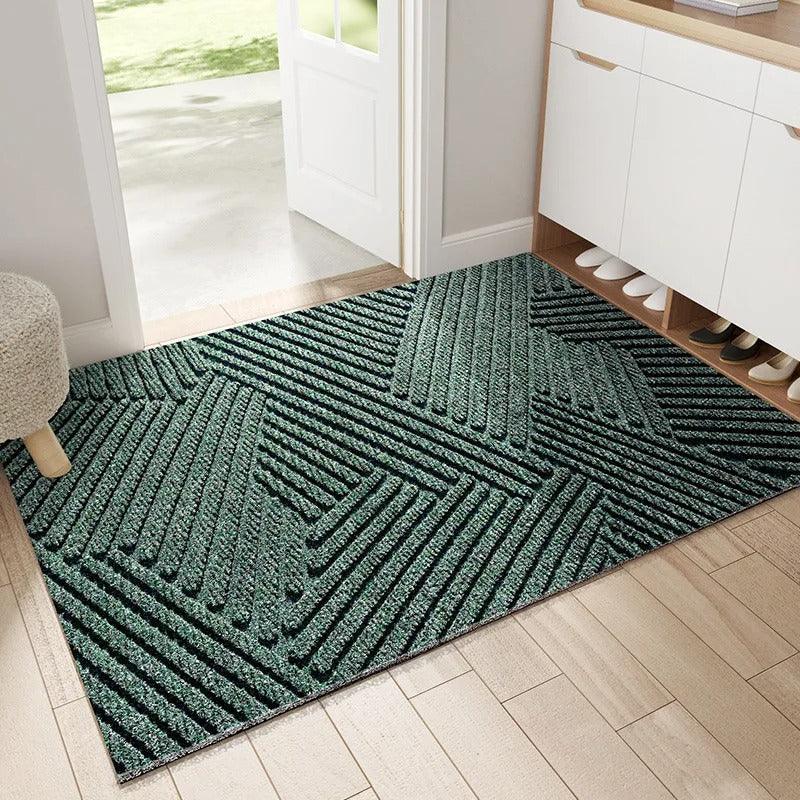 Green textured entryway rug with geometric pattern in a hallway