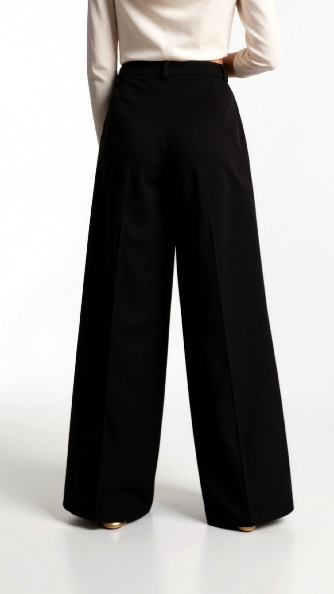 Women's woven trousers featuring a high-rise waistband and wide leg cut